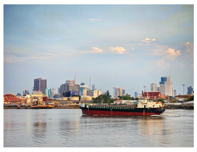 Cargo ship representing energy intensive shipping sector in Europe