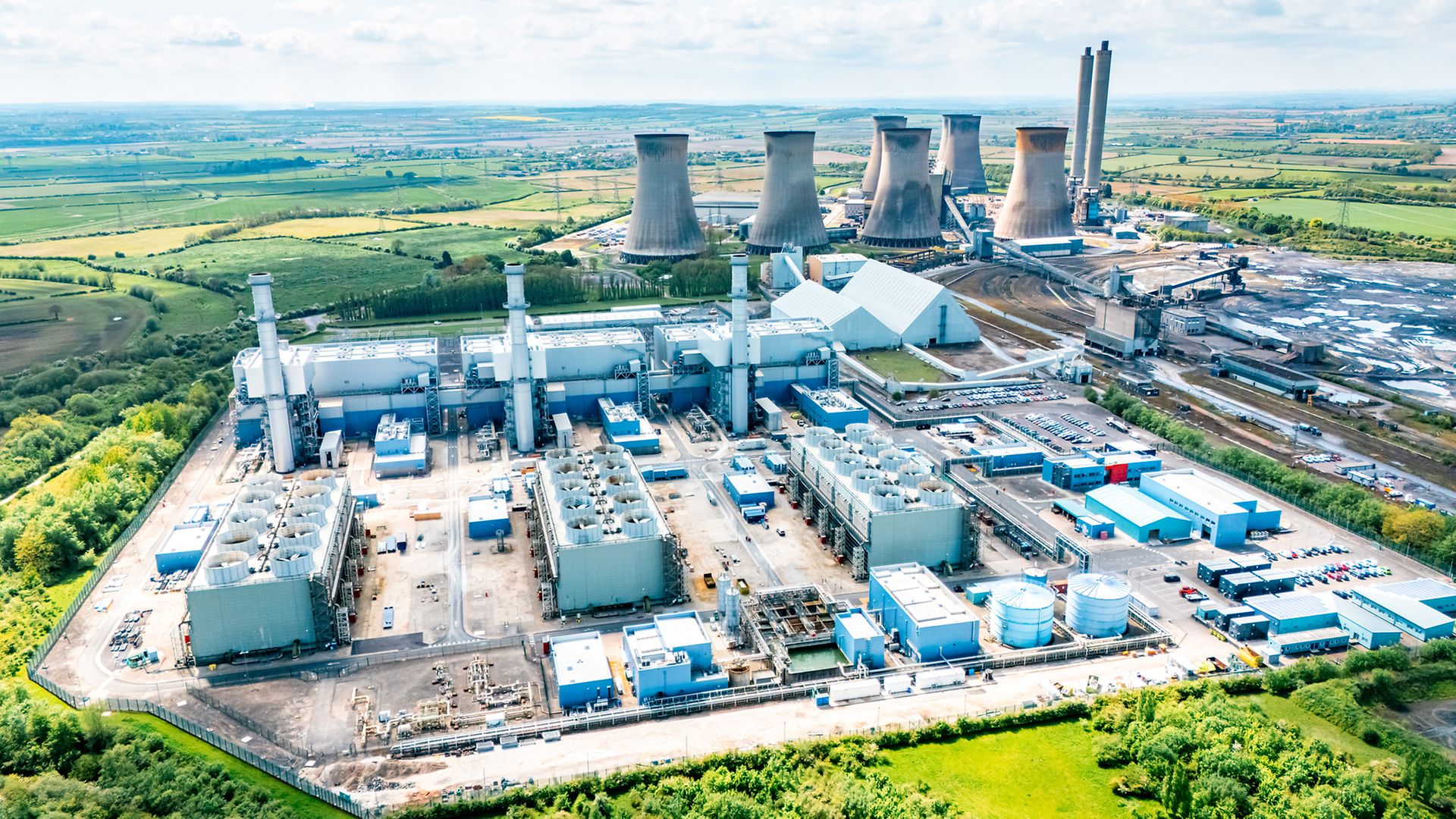 Gas-fired power plant and electricity generation infrastructure | European Gas Hub Aerial view of a gas-fired power plant with cooling towers and surrounding energy infrastructure